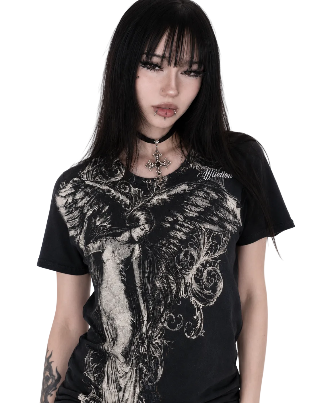 Person wearing a black t-shirt with intricate design and 'Affliction' branding.