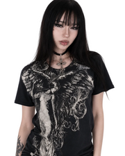 Person wearing a black t-shirt with intricate design and 'Affliction' branding.